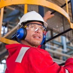A man wearing hearing protection on the job.