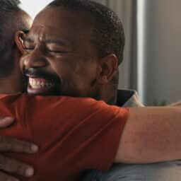 Offering support to a loved one, two people hugging