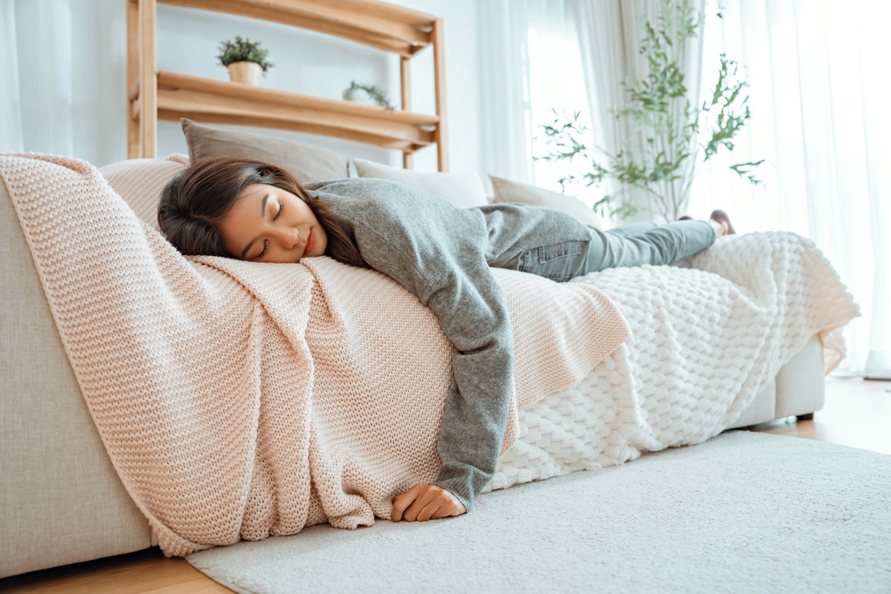 Woman taking a nap on the couch.
